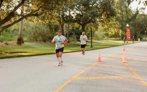a group of men running on a road