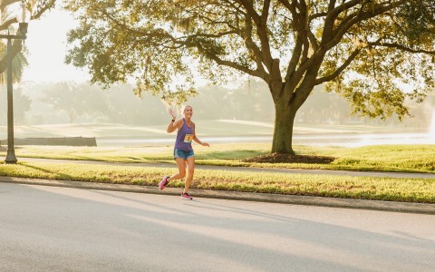a woman running on a road