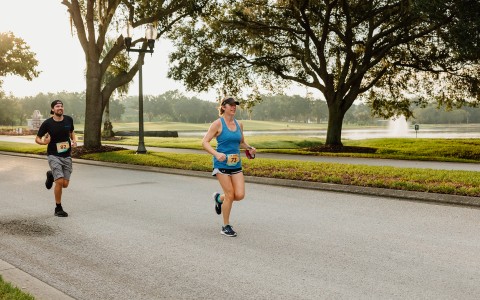 a woman running on a road
