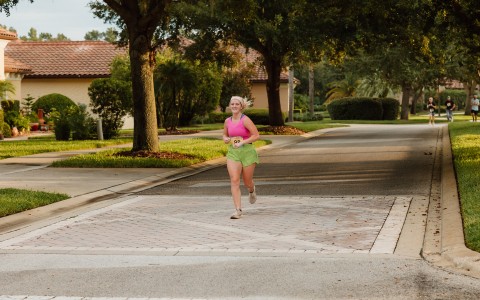 a woman running on a street