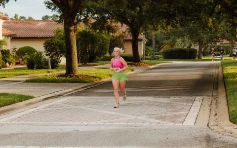 a woman running on a street