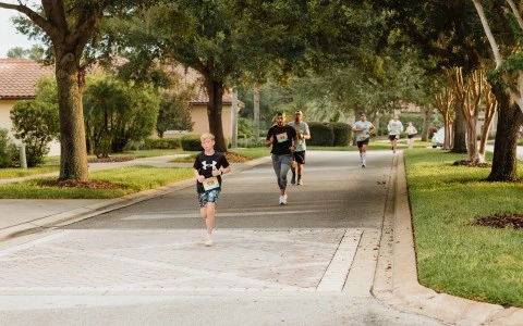 a group of people running on a road