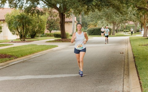 a woman running on a road
