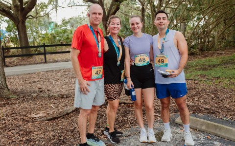 a group of people wearing matching running outfits