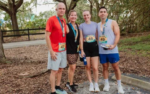 a group of people wearing matching running outfits