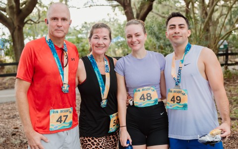 a group of people wearing medals