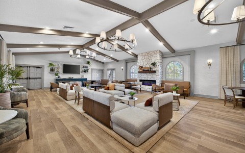 a large room with couches and a fireplace