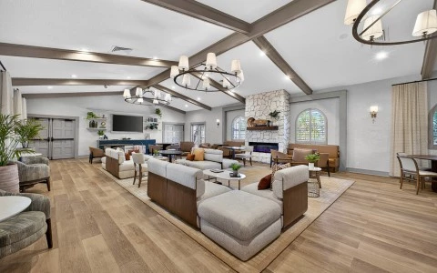 a large room with couches and a fireplace