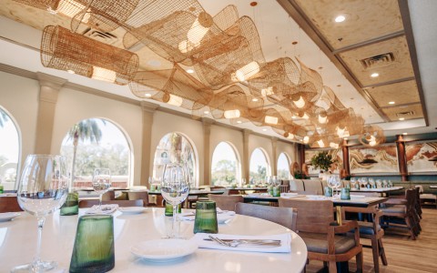 a restaurant with tables and chairs