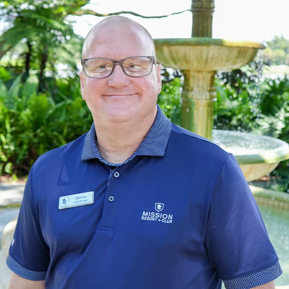 a man wearing glasses and a blue shirt