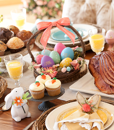 a table with food and a basket of eggs