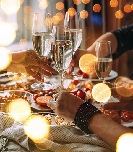 a group of people holding glasses of champagne