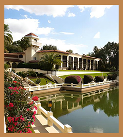 a building with a pond and a bridge
