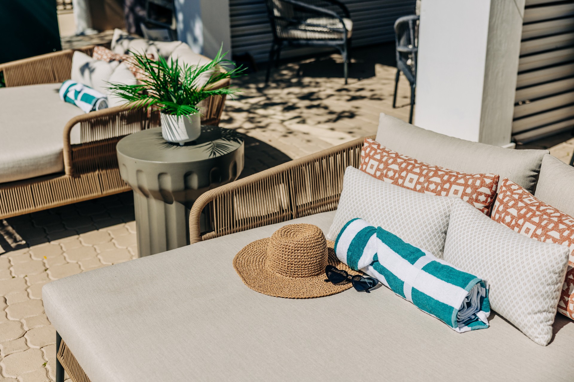 a table with a towel and sunglasses on it