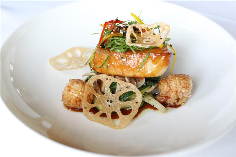 a plate of food on a white surface