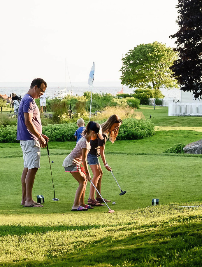 a group of people playing golf