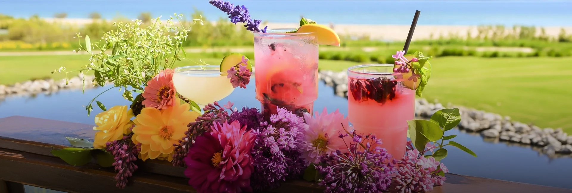 a group of drinks with flowers