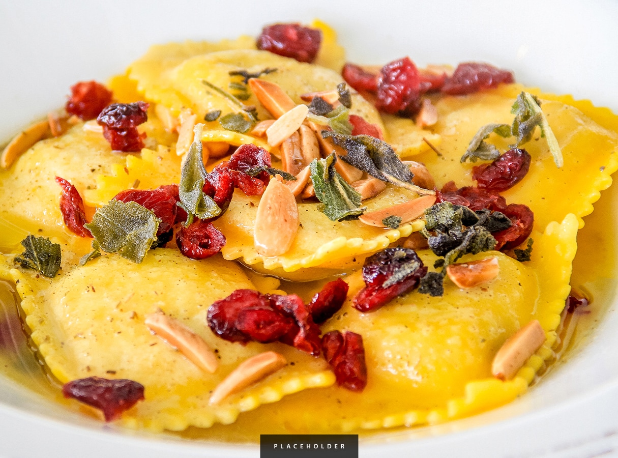 a plate of food with dried cranberries and nuts