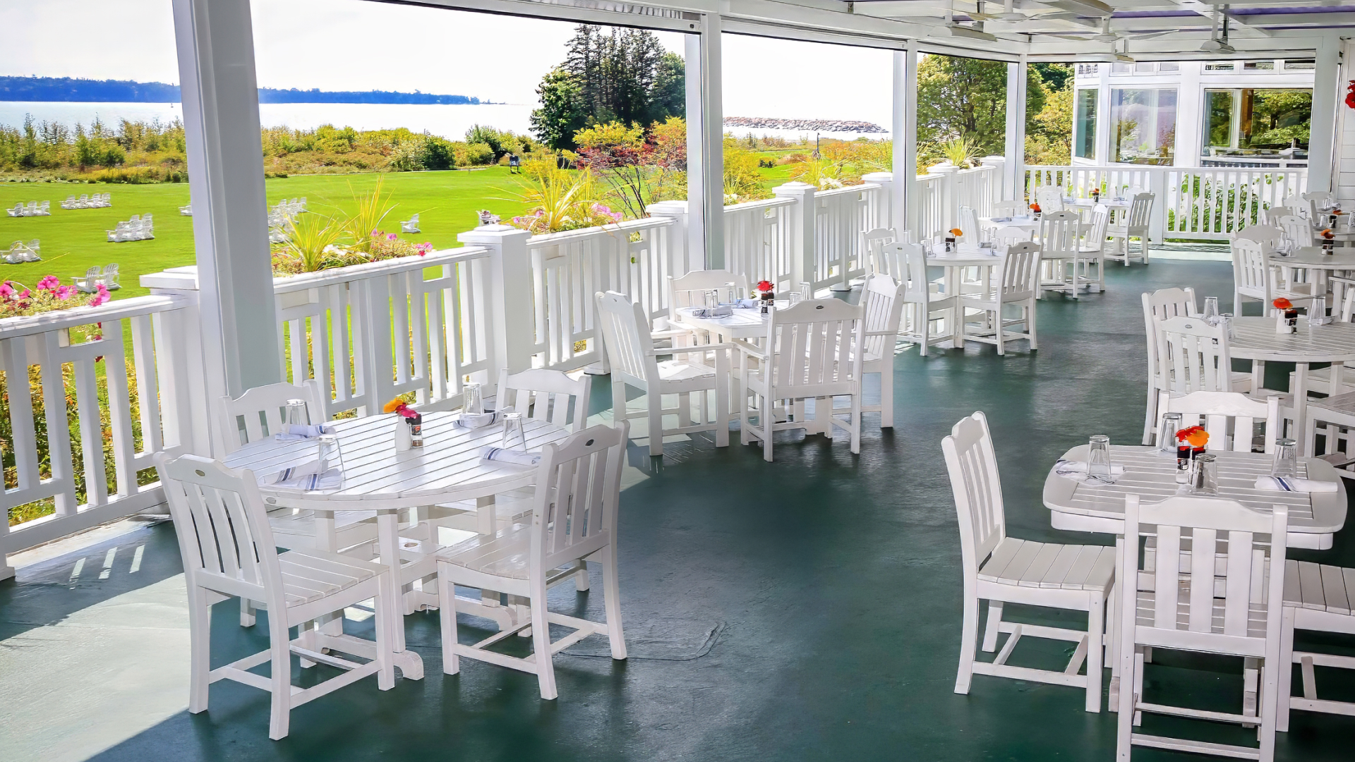 a white tables and chairs on a patio