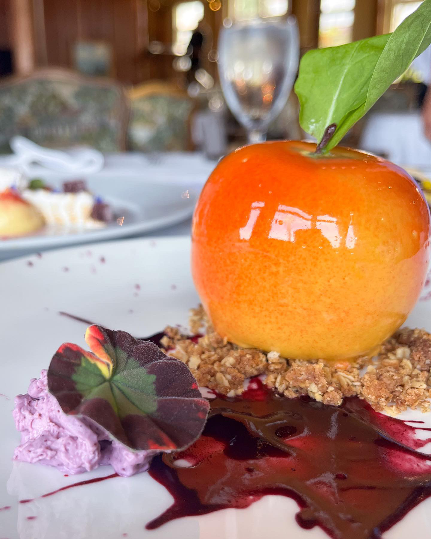 a plate of food with a fruit on top