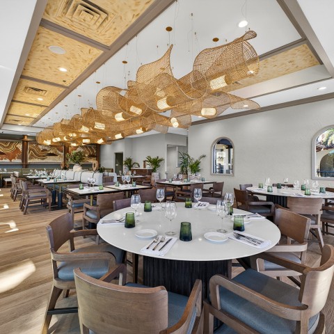 a large room with tables and chairs