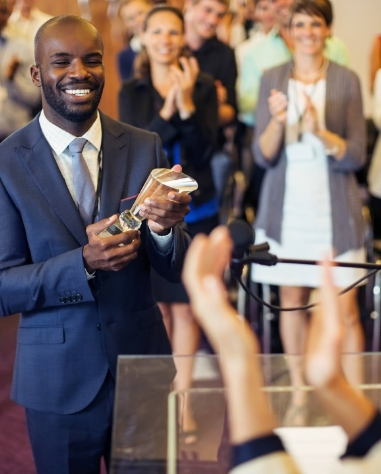 a man holding a trophy