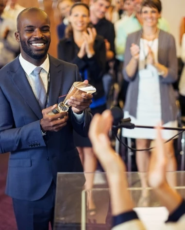 a man holding a trophy