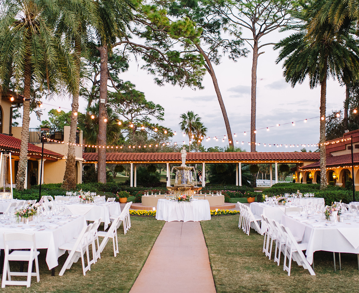 a group of tables set up for a wedding reception