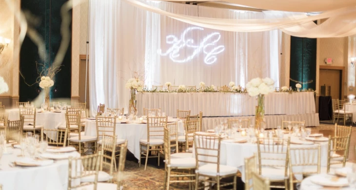 a wedding reception with tables and chairs