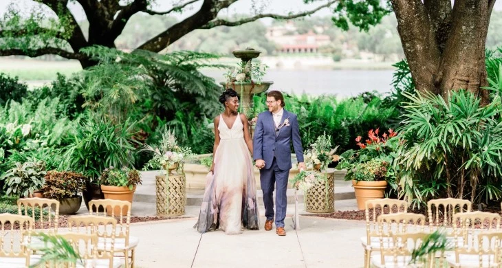 a man and woman walking down a walkway