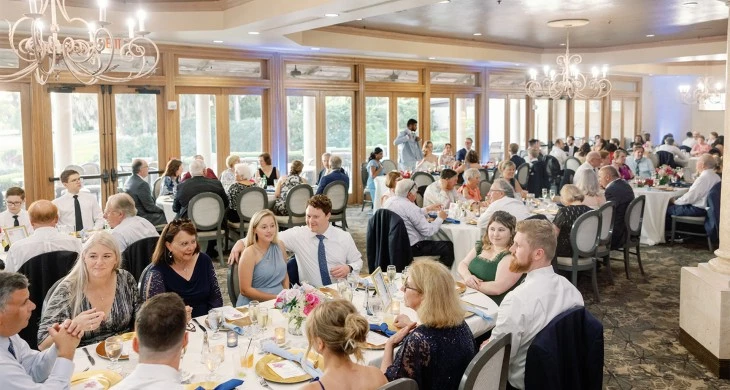 a group of people sitting at tables in a room