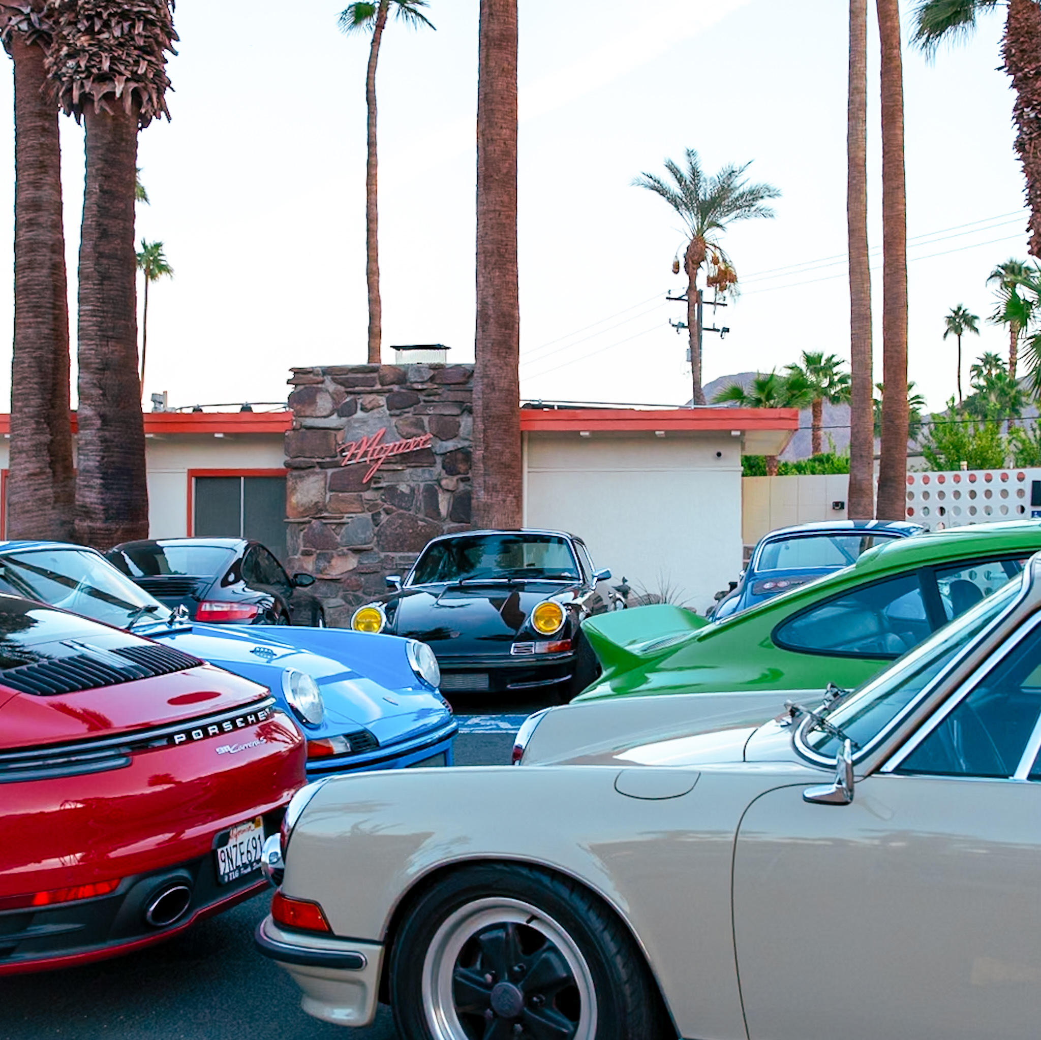 a group of cars parked in a parking lot