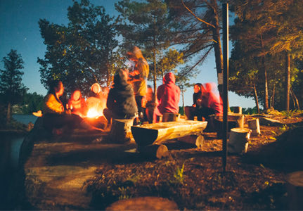 people around a campfire