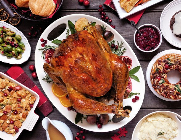 a turkey on a platter with different foods on it