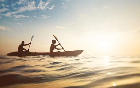 a person in a canoe on the water