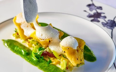 a plate of food with a spoon