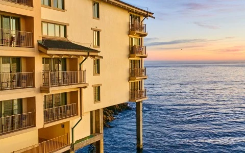 a building with balconies on the water