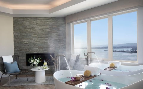 a bathtub with water in the background