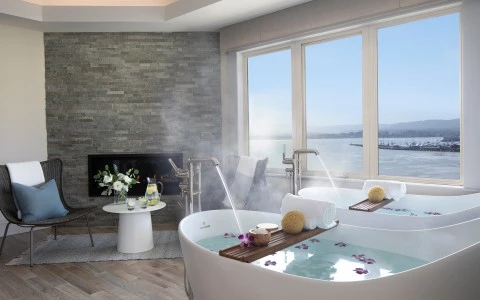a bathtub with hot water in the middle of the room