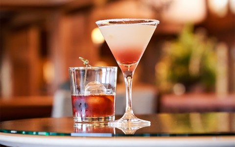 a glass of liquid and a glass of liquid on a table