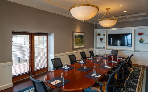 a conference room with a large table and chairs