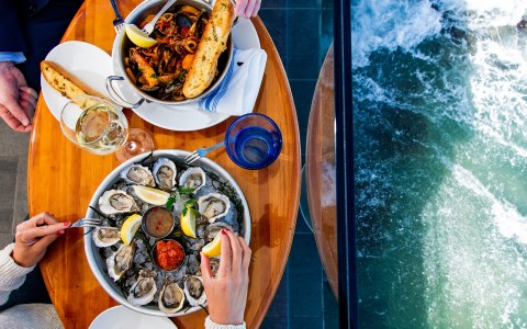 a person eating food on a table