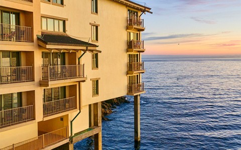 a building with balconies on the water