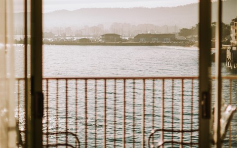 a view of a city from a balcony of a house