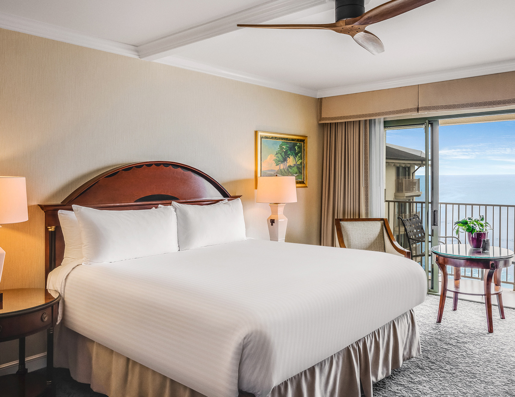 a room with a bed and a ceiling fan