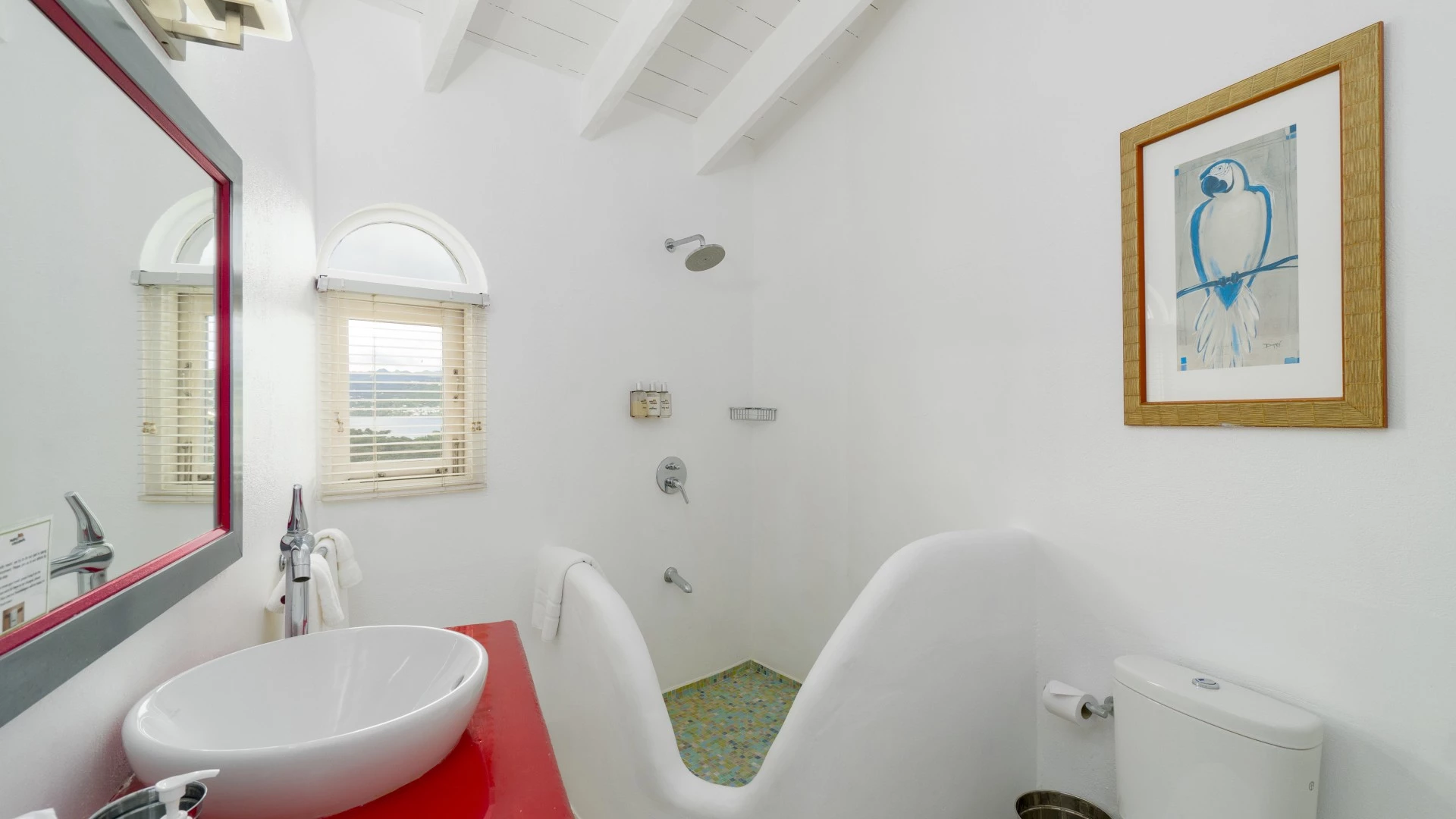 a bathroom with a red counter and sink