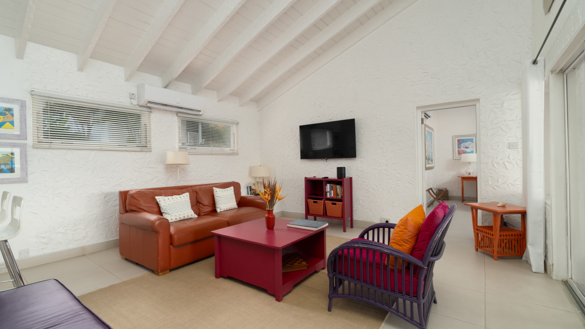 a living room with a couch and a tv