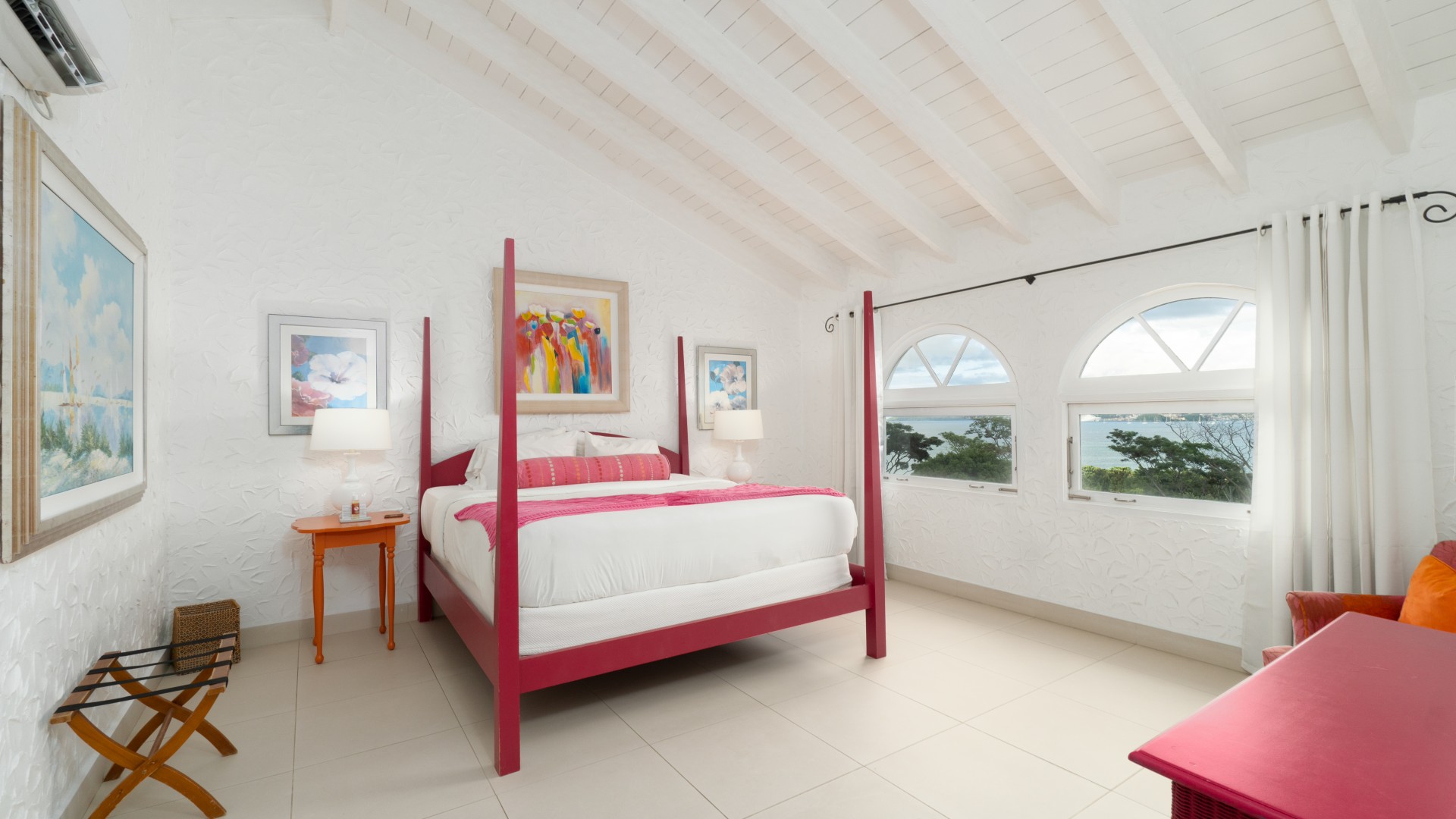 a bedroom with a bed and a table