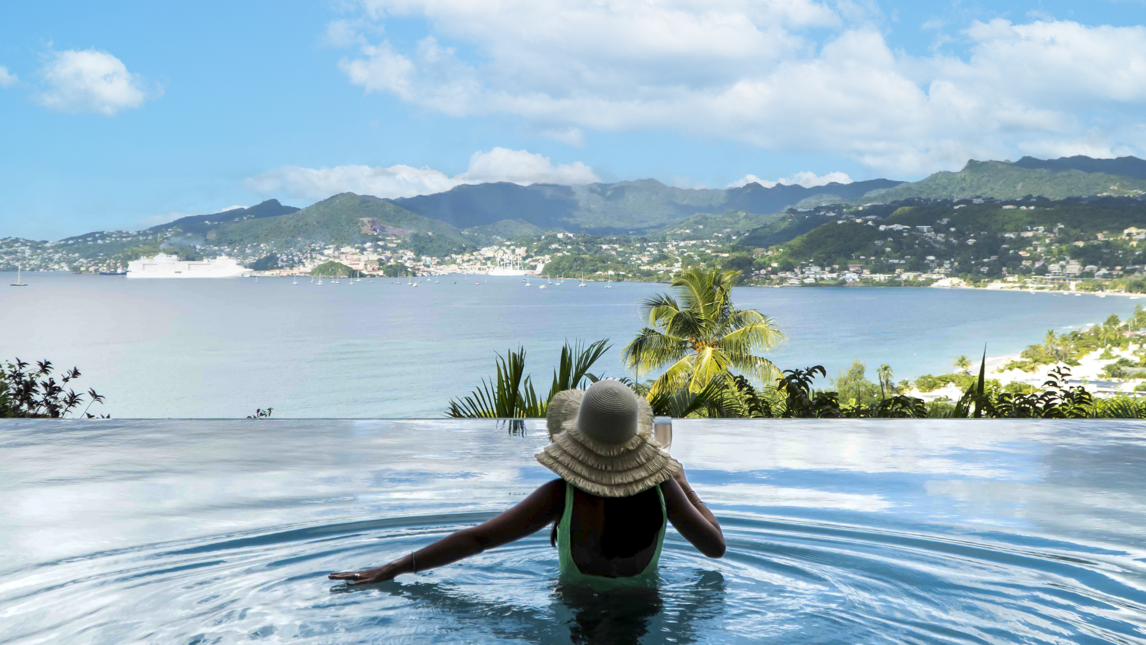 a man pointing at a woman on a balcony