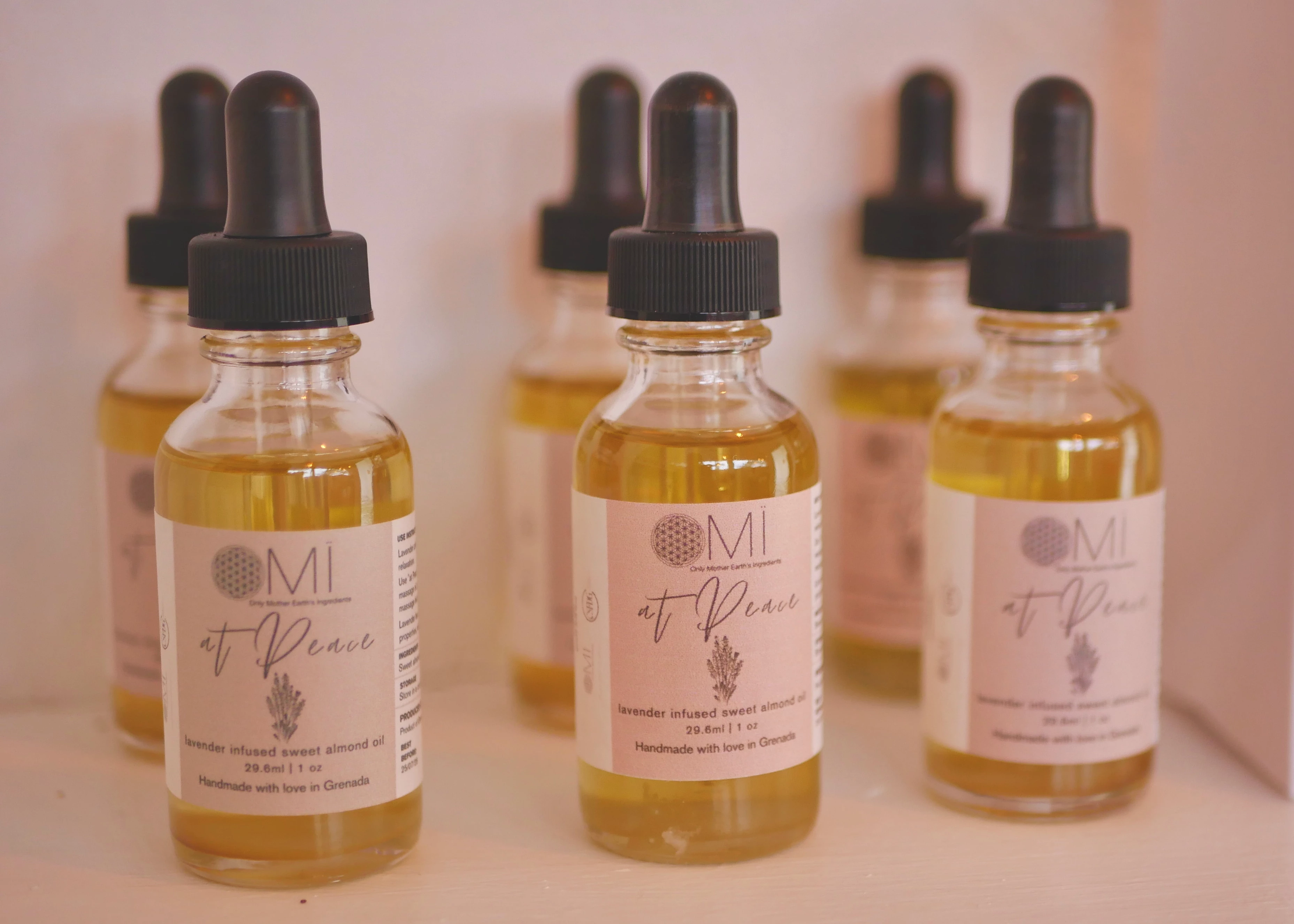 a group of bottles with yellow liquid